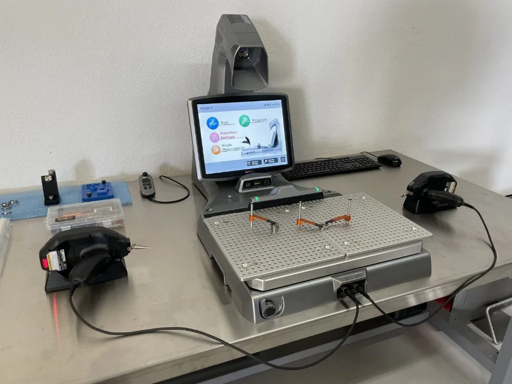 The Keyence XM coordinate measuring machine on the inspection bench